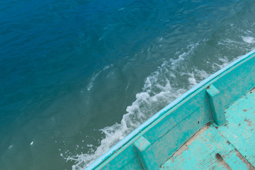 Top view of wooden boats that groove on the turquoise sea.