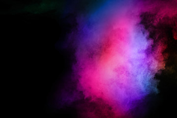 abstract colored dust explosion on a black background.abstract powder splatted background.