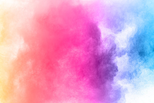 abstract powder splatted background. Colorful powder explosion on white background. © kitsana