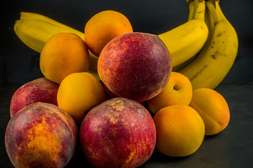 Ripe peaches and apricots, a template for advertising, juicy summer fruits