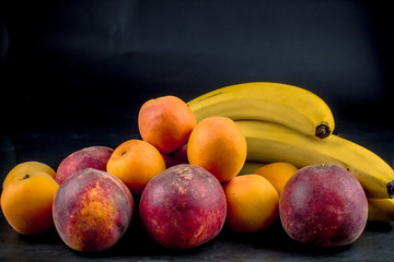 Ripe peaches and apricots, a template for advertising, juicy summer fruits, copy space