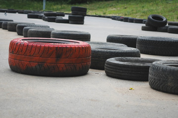 a bunch of rubber tires for cars. enclosing territory.