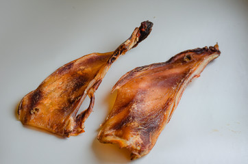 Beef Scappy Chewz. Natural treats for dogs. A few pieces on a white background.