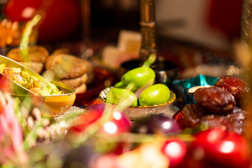 Close Up of Table decorated with Autumn and Winter Fruits and Edibles