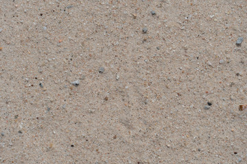 Top view of sand gravel on the beach for background and texture.