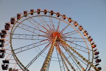 ferris wheel on background of blue sky