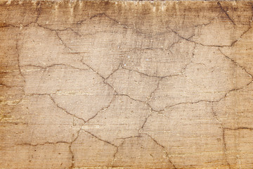 beige background texture of old cracked wall closeup