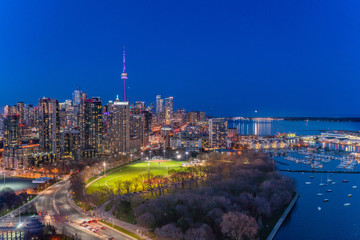Toronto skyline in early evening with lake 