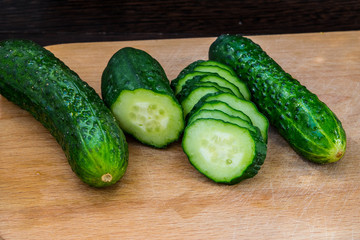 Cucumbers on a cutting board close up for healthy eating