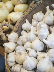 basket with garlic and onions well organized in a fruit shop