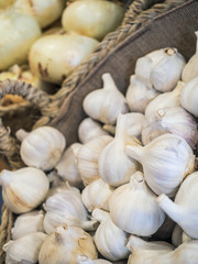 basket with garlic and onions organized in a fruit shop