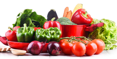 Fresh vegetables and cooking pot on kitchen table