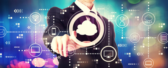 Cloud computing with a businessman on a shiny background