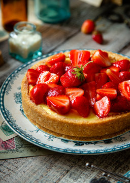 Homemade delicious strawberry tart or pie with sweet berries on top