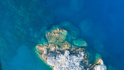 Fototapeta na wymiar Aerial photo above rock reef crystal clear blue sea water