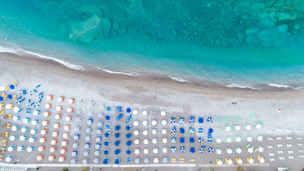 Beach and waves from top view. Aerial turquoise water background. Summer seascape from the air. Travel concept. 