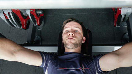 Healthy lifestyle concept. fitness young man lifting weights in the gym. 