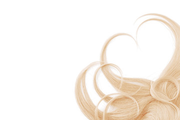 Blond hair isolated on white background. Heart shape