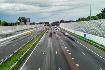 Traffic over the highway, motion blurred traffic, ring east A10, 06/14/2019 Amsterdam the Netherlands, speedway, freeway fast