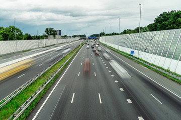 Fototapeta na wymiar Traffic over the highway, motion blurred traffic, ring east A10, 06/14/2019 Amsterdam the Netherlands, speedway, freeway fast