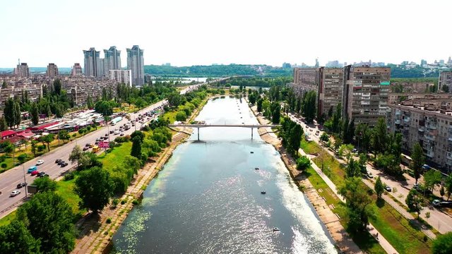 4K, Drone, Slow moving shot of the water canal and apartment buildings at Rusanovka Island, Ukraine.
