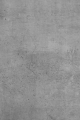 Graue Betonwand, Grauer Hintergrund, Rustikale Textur im Hochformat