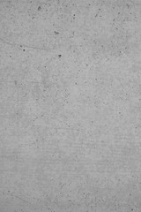 Graue Betonmauer, Grauer Hintergrund, Grau Struktur mit groben und zerkratzen Stzrukturen im Indiustrial Design. Graue Steinmauer als Hintergrund und gestalterisches Element.