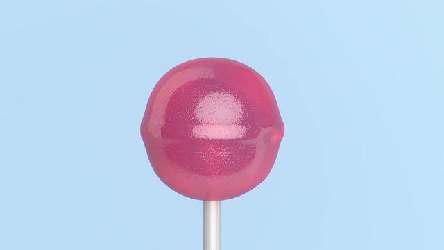 Spinning lollipop on light blue background