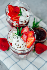 Sweet strawberry chia pudding dessert with cream and jelly