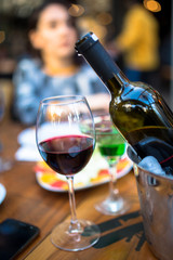 red wine on open air restaurant cafe romantic joyful young adults table
