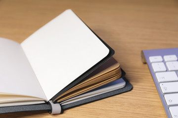 Office desk table with note book and keyboard