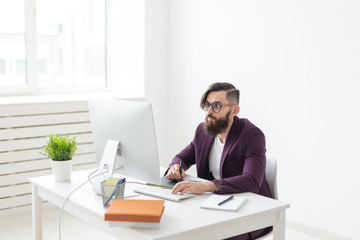 Fototapeta premium People, designer and technology concept - Man illustrator with thoughtful look, working environment