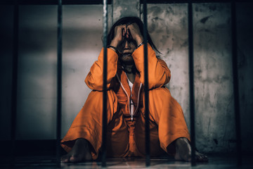 Portrait of women desperate to catch the iron prison,prisoner concept,thailand people,Hope to be...