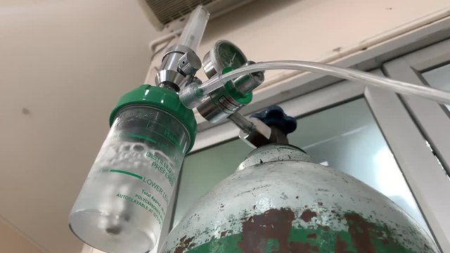 Closeup of oxygen humidifier bottle. Oxygen tank.