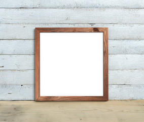 Square Old Wooden Frame mockup  stands on a wooden table on a painted white wooden background. Rustic style, simple beauty. 3d render.