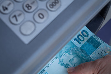 Brazilian money withdrawn from an ATM