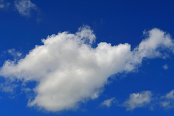 A big white cloud in a deep blue sky