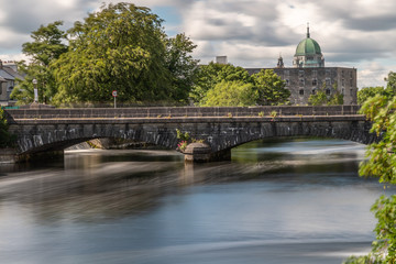 Fototapeta na wymiar Bridge over Corrib River with Cathedral in background