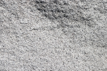 Texture natural smooth stone. Background natural stone with gray color. Black spots.