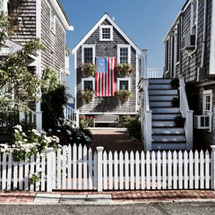 United States flag at suburban neighborhood. Provincetown, Cape Cod, Massachusetts, USA. - 273523703