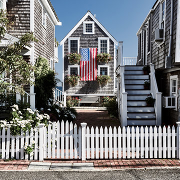 United States flag at suburban neighborhood. Provincetown, Cape Cod, Massachusetts, USA.