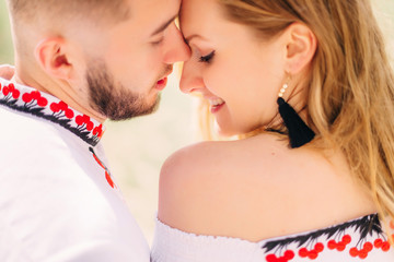 the bearded guy and the girl closed their eyes and leaned their