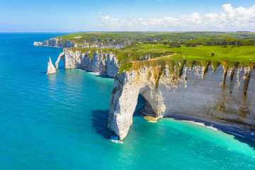 Picturesque panoramic landscape on the cliffs of Etretat. Natural amazing cliffs. Etretat, Normandy, France, La Manche or English Channel. Coast of the Pays de Caux area in sunny summer day. France - obrazy, fototapety, plakaty