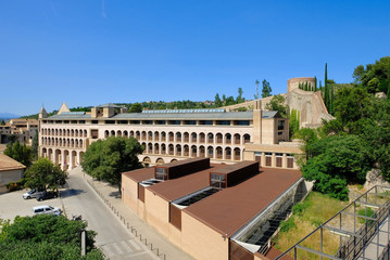 Fototapeta na wymiar The bell tower of Sant Feliu Collegiate Church, from the Cathedral of Saint Mary of Girona, Girona, Catalonia, Spain.