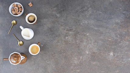 Obraz na płótnie Canvas Сoffee pot, two cups of espresso , milk jug and sugar on dark background with ccopy space. Love coffee concept.