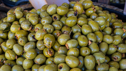 Olives stuffed with anchovy, typical Spanish food, pickles in vinegar