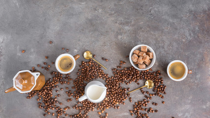 Сoffee pot, two cups of  espresso , milk jug and  sugar on dark background with coffee beans. Love...