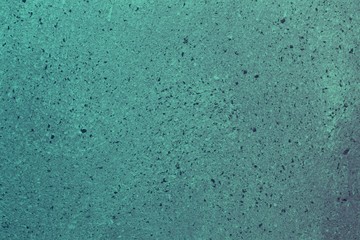 teal, sea-green grainy scratched cover on the desk texture - pretty abstract photo background