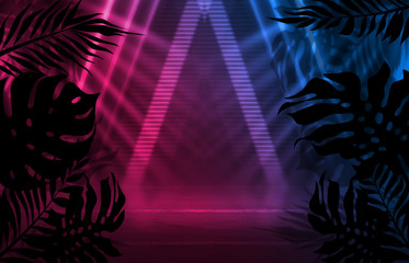 Background of empty dark scenes with neon lights and shapes, smoke. Silhouettes of tropical palm leaves in the foreground. Bright futuristic abstract background