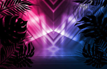 Background of empty dark scenes with neon lights and shapes, smoke. Silhouettes of tropical palm leaves in the foreground. Bright futuristic abstract background